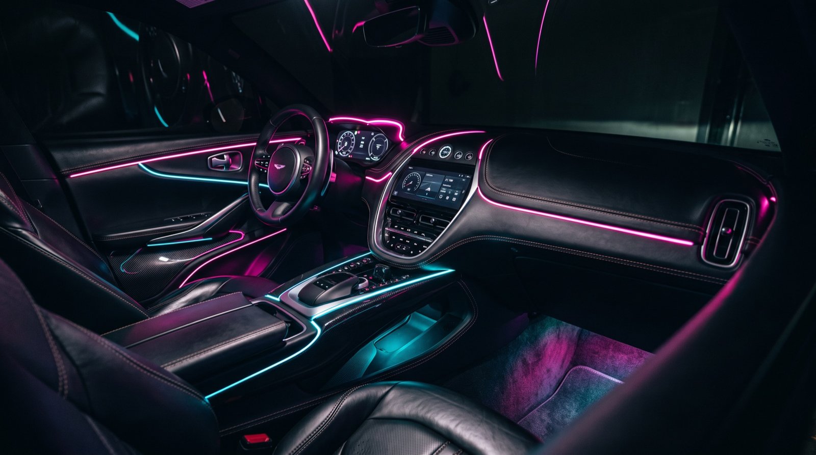 Car interior lit with magenta and cyan ambient fibre-optic lighting